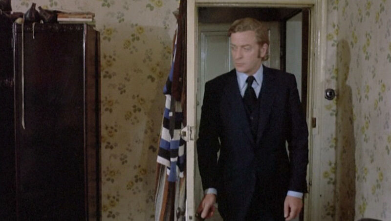 get-carter_michael-caine-blue-suit_front-moving-5345009