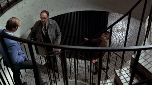 the-conversation_gene-hackman_raincoat-top-stairwell-4688135