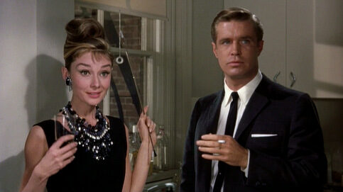 breakfast-at-tiffanys_audrey-hepburn-holder-george-peapprd_cap-5163719