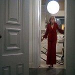 rosemarys-baby_mia-farrow_red-trouser-suit_doorway-walking-bmp-5397216