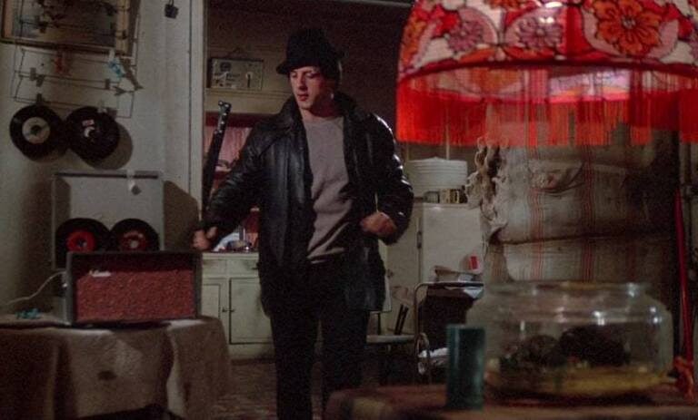 rocky_1976_sylvester-stallone-leather-jacket-fedora-front_cap-1925018